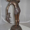 Boy holding a Dog and a Bird Bronze Statue -  Size: 15"L x 15"W x 36"H.