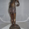 Boy holding a Dog and a Bird Bronze Statue -  Size: 15"L x 15"W x 36"H.