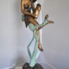 Beautiful Young Girl Sitting on a Tree Bronze Statue -  35"L x 50"W x 55"H.