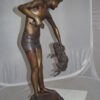 Boy holding a Dog and a Bird Bronze Statue -  Size: 15"L x 15"W x 36"H.