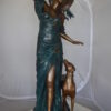 Lady With Her Dog Bronze Statue -  Size: 25"L x 22"W x 50"H.