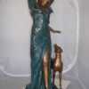 Lady With Her Dog Bronze Statue -  Size: 25"L x 22"W x 50"H.