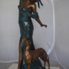 Lady With Her Dog Bronze Statue -  Size: 25"L x 22"W x 50"H.