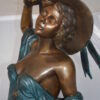 Lady With Her Dog Bronze Statue -  Size: 25"L x 22"W x 50"H.