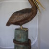 Pelican on a Stump Bronze Statue -  Size: 14"L x 38"W x 58"H.