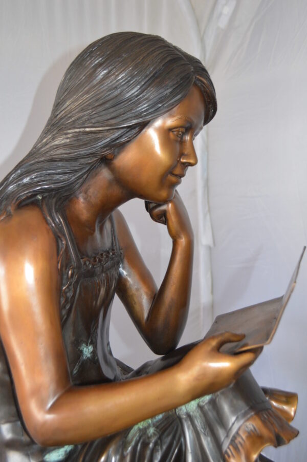 Girl Reading Letters on the Stairs Bronze Statue -  Size: 32"L x 22"W x 40"H.