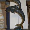 Two Dolphins Overreach Others on Waves Bronze Statue -  44"L x 23"W x 76"H.