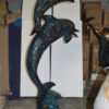 Two Dolphins Overreach Others on Waves Bronze Statue -  44"L x 23"W x 76"H.