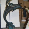 Two Dolphins Overreach Others on Waves Bronze Statue -  44"L x 23"W x 76"H.