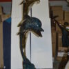 Two Dolphins Overreach Others on Waves Bronze Statue -  44"L x 23"W x 76"H.