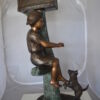 Boy Sitting on a Tree with Mailbox Bronze Statue -  Size: 22"L x 23"W x 49"H.