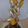 Cupid Girl On A Rock Bronze Statue  -  Size: 20"L x 15"W x 25"H.