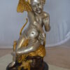 Cupid Girl On A Rock Bronze Statue  -  Size: 20"L x 15"W x 25"H.