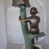 Boy Sitting on a Tree with Mailbox Bronze Statue -  Size: 22"L x 23"W x 49"H.