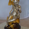 Cupid Girl On A Rock Bronze Statue  -  Size: 20"L x 15"W x 25"H.