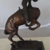 Rattlesnake by Remington Bronze Statue -  Size: 16"L x 13"W x 22"H.