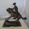 Remington Cowboy on marble Bronze Statue -  Size: 24"L x 9"W x 23"H.