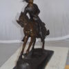 Remington Cowboy on marble Bronze Statue -  Size: 24"L x 9"W x 23"H.