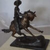 Remington Cowboy on marble Bronze Statue -  Size: 24"L x 9"W x 23"H.