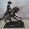 Remington Cowboy on marble Bronze Statue -  Size: 24"L x 9"W x 23"H.