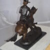 Remington Cowboy on marble Bronze Statue -  Size: 24"L x 9"W x 23"H.