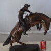 Bronco Buster Bronze Statue by Remington -  Size: 9"L x 24"W x 21"H.