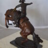 Bronco Buster Bronze Statue by Remington -  Size: 9"L x 24"W x 21"H.