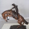 Bronco Buster Bronze Statue by Remington -  Size: 9"L x 24"W x 21"H.