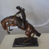 Bronco Buster Bronze Statue by Remington -  Size: 9"L x 24"W x 21"H.