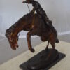 Bronco Buster Bronze Statue by Remington -  Size: 9"L x 24"W x 21"H.