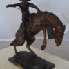 Bronco Buster Bronze Statue by Remington -  Size: 9"L x 24"W x 21"H.