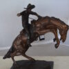 Bronco Buster Bronze Statue by Remington -  Size: 9"L x 24"W x 21"H.