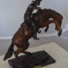 Bronco Buster Bronze Statue by Remington -  Size: 9"L x 24"W x 21"H.