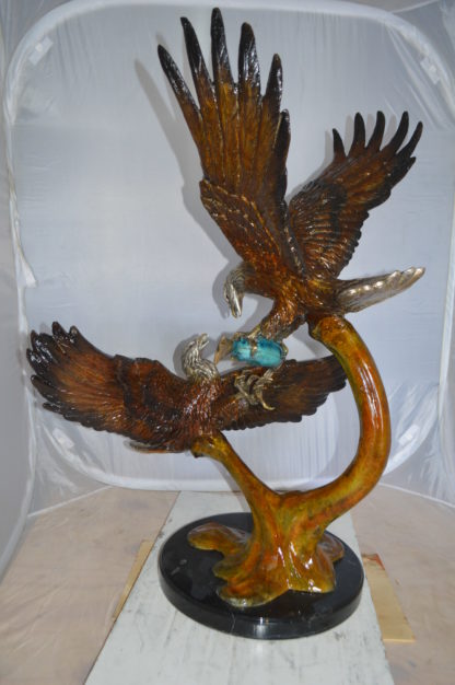 Two Eagles Fighting on Fish Bronze Statue -  Size: 33"L x 28"W x 42"H.