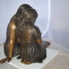 Two Girls Reading a Book Bronze Statue -  Size: 33"L x 21"W x 23"H.