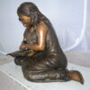 Two Girls Reading a Book Bronze Statue -  Size: 33"L x 21"W x 23"H.