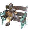 Girl sitting with her dog  on a bench,  reading Bronze Statue - 27" x 39" x 32"H