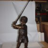 Golfer Boy Bronze - Big shoes -  Size: 18"L x 14"W x 49"H.