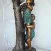 Two Kids Climbing on a Tree Bronze Statue -  Size: 17"L x 17"W x 46"H.