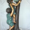 Two Kids Climbing on a Tree Bronze Statue -  Size: 17"L x 17"W x 46"H.