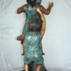 Two Kids Climbing on a Tree Bronze Statue -  Size: 17"L x 17"W x 46"H.