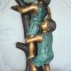 Two Kids Climbing on a Tree Bronze Statue -  Size: 17"L x 17"W x 46"H.