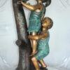 Two Kids Climbing on a Tree Bronze Statue -  Size: 17"L x 17"W x 46"H.