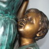 Two Kids Climbing on a Tree Bronze Statue -  Size: 17"L x 17"W x 46"H.