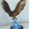 Eagle Catching his Prey Bronze Statue -  Size: 17"L x 20"W x 25"H.