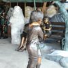 Two Kids Holding an Umbrella - Bronze Statue - Fountain -  90"L x 34"W x 90"H.