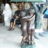 Two Kids Holding an Umbrella - Bronze Statue - Fountain -  90"L x 34"W x 90"H.