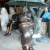 Two Kids Holding an Umbrella - Bronze Statue - Fountain -  90"L x 34"W x 90"H.