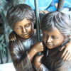 Two Kids Holding an Umbrella - Bronze Statue - Fountain -  90"L x 34"W x 90"H.