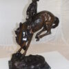 Outlaw Remington Bronze Statue -  Size: 19"L x 10"W x 26"H.